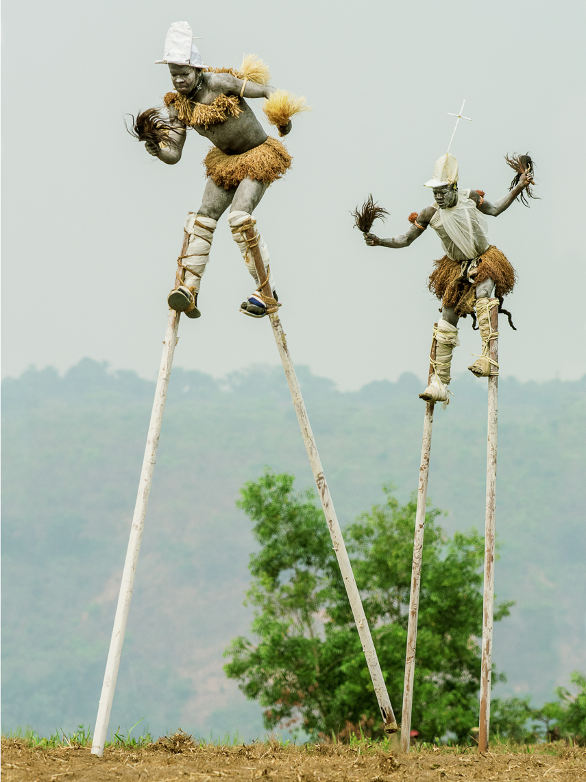 Pende "Tall men walking" Stilt Dancers, Gungu, D.R. Congo